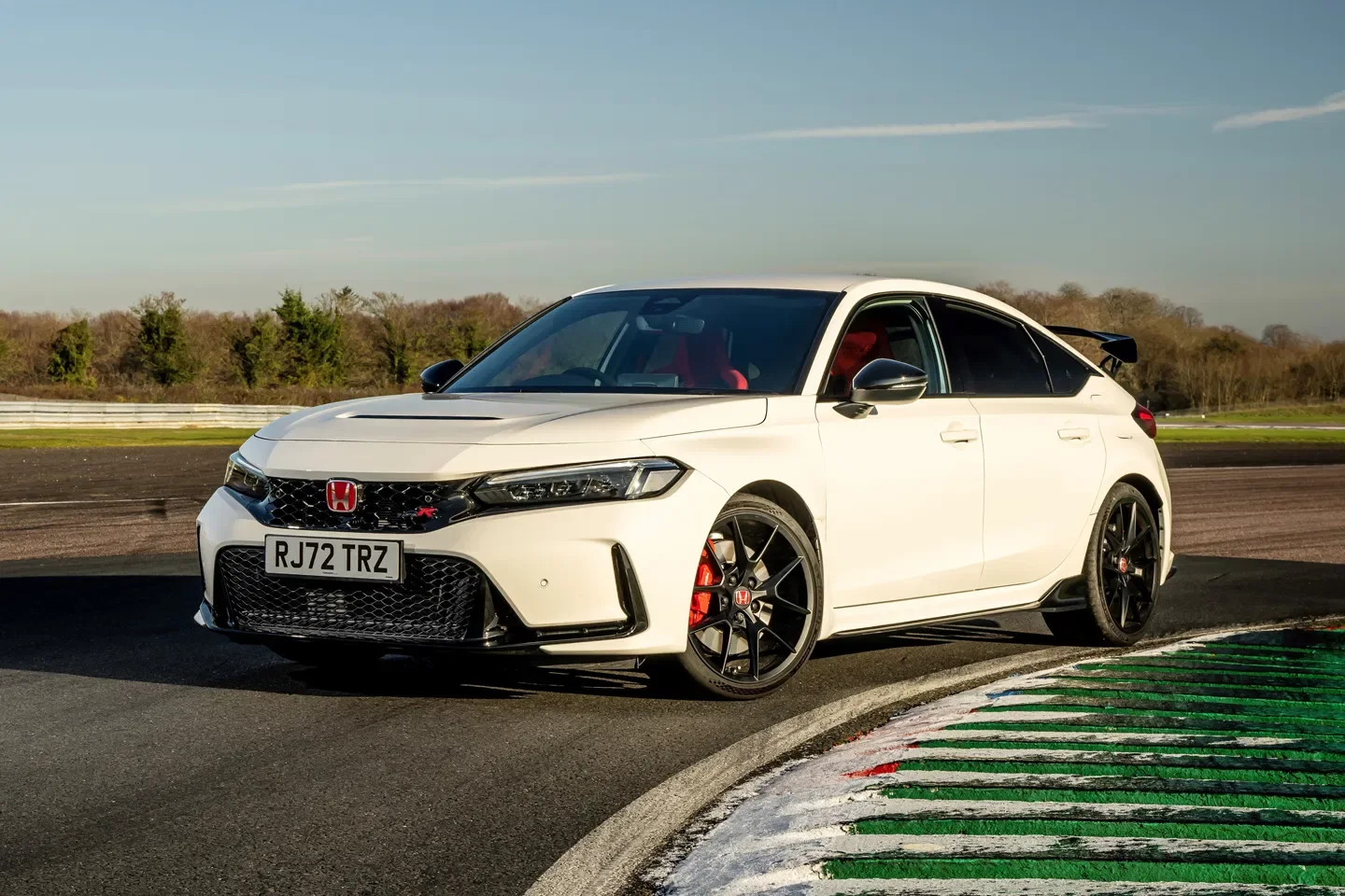 Championship White Honda Civic Type R FL5 on a circuit